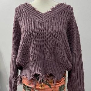 Main strip distressed off the shoulder sweater